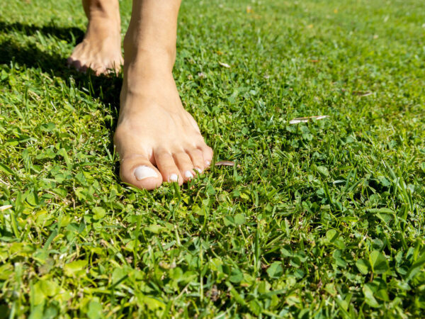 walking barefoot on the grass pain free